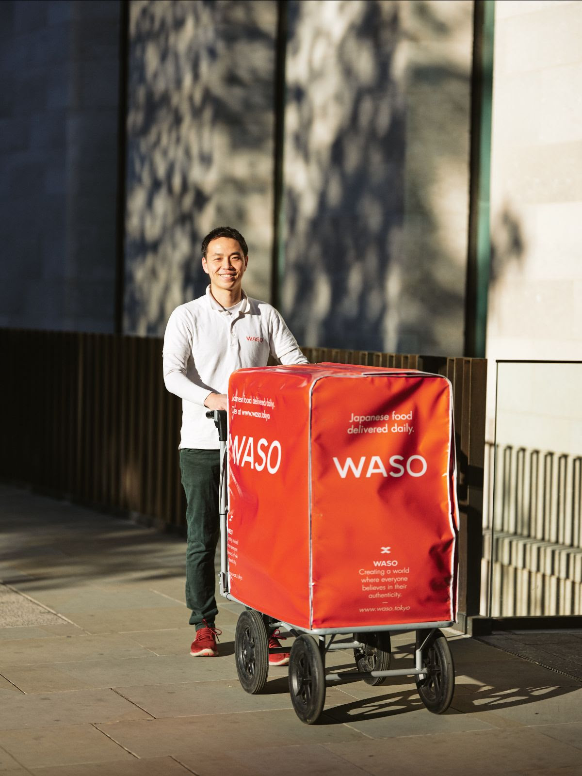 Founder with a red delivery trolley in London